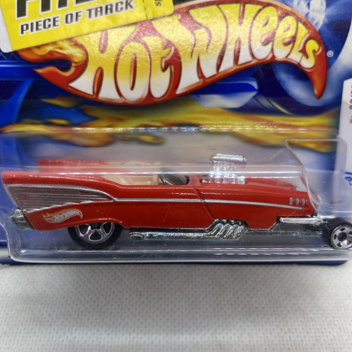 Red Hot Wheels ’57 Roadster die-cast car in clear blister, side view