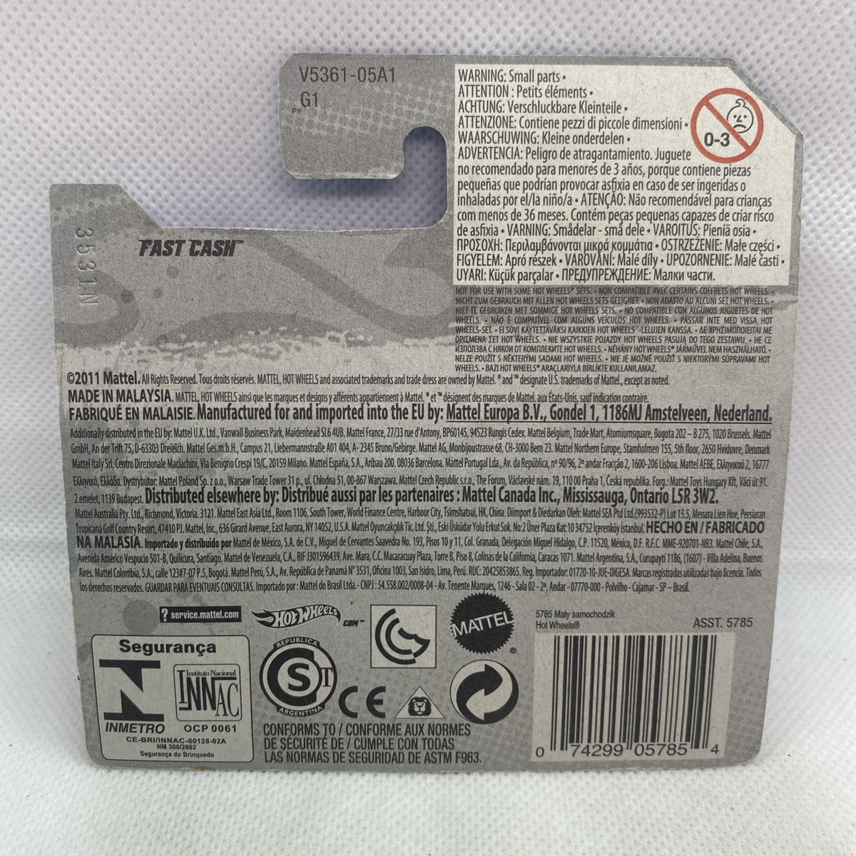 Hot Wheels diecast car cardback with product info, warning text, and barcode