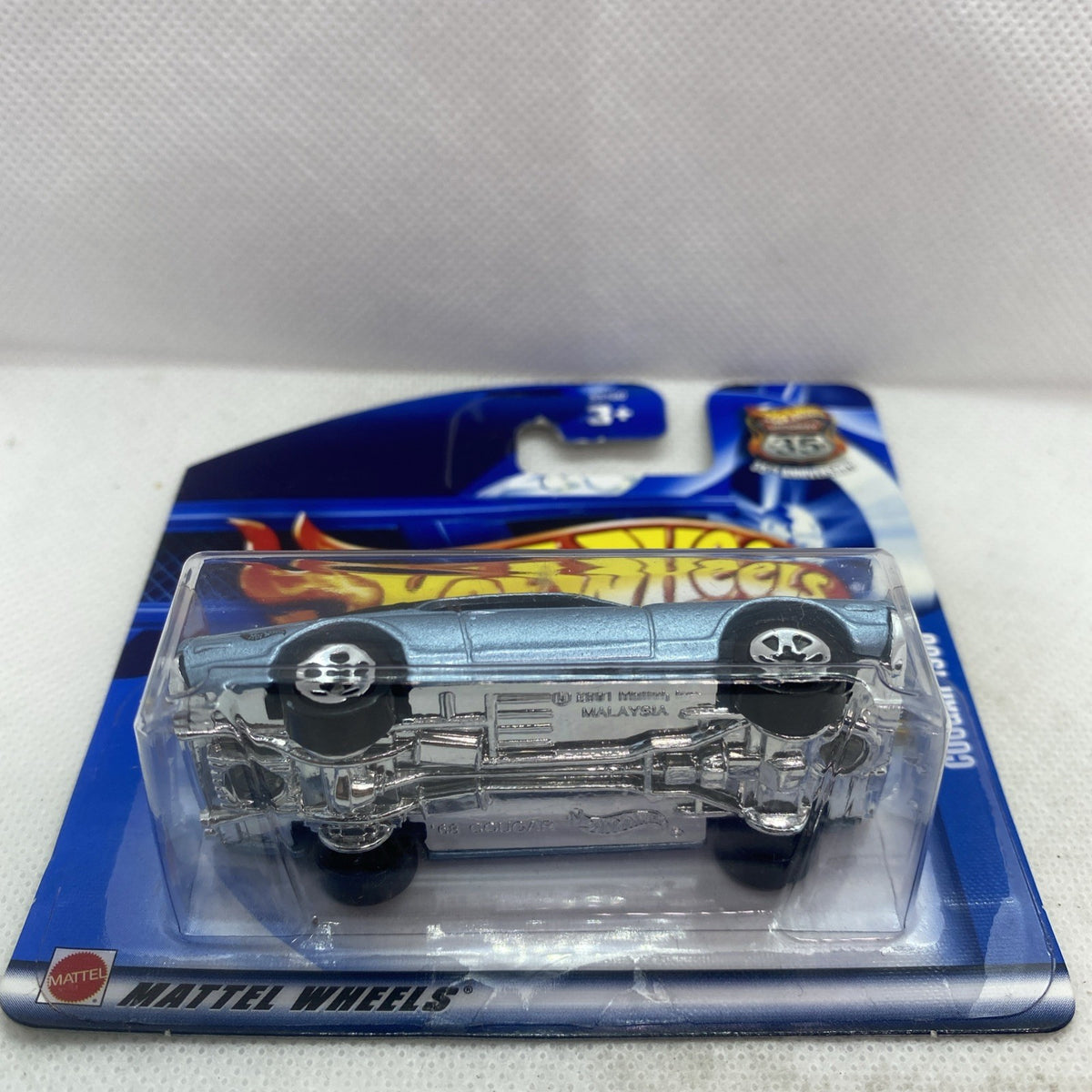 Hot Wheels die-cast ’68 Cougar on blue blister card, underside and side view