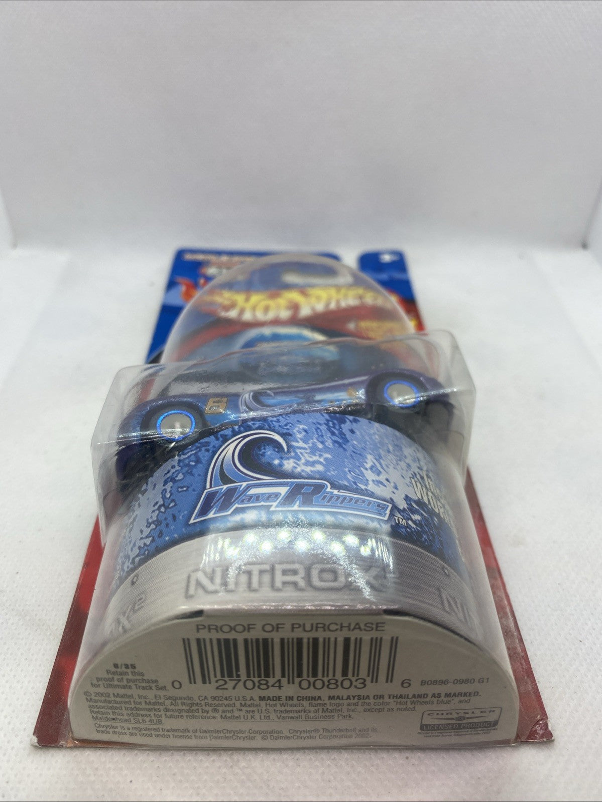 Hot Wheels World Race die-cast car in blister pack, rear view
