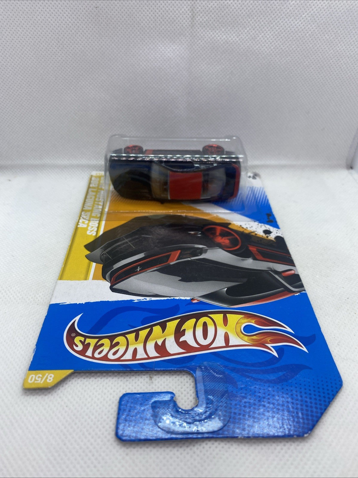 Hot Wheels HW Premiere card with clear blister and black sports car, red wheel accents
