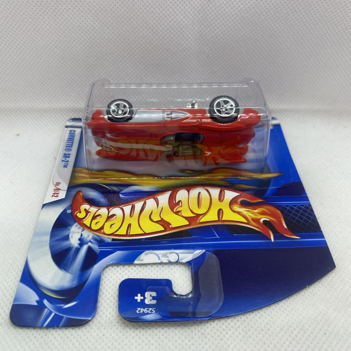Hot Wheels short-card blister with red Corvette SR-2 die-cast, clear top view