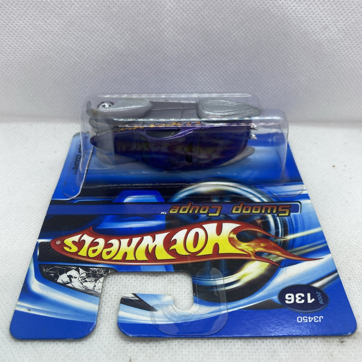 Purple and silver Hot Wheels Swoop Coupe toy car in sealed blister card, #136.