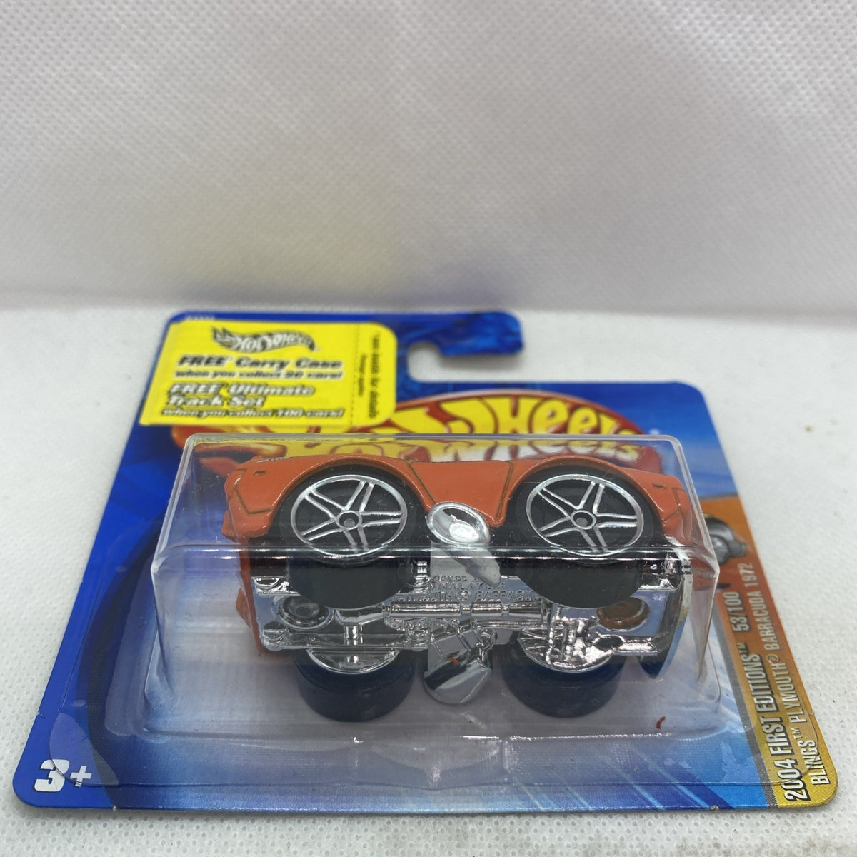 Hot Wheels orange Plymouth Barracuda die-cast with chrome wheels in clear blister