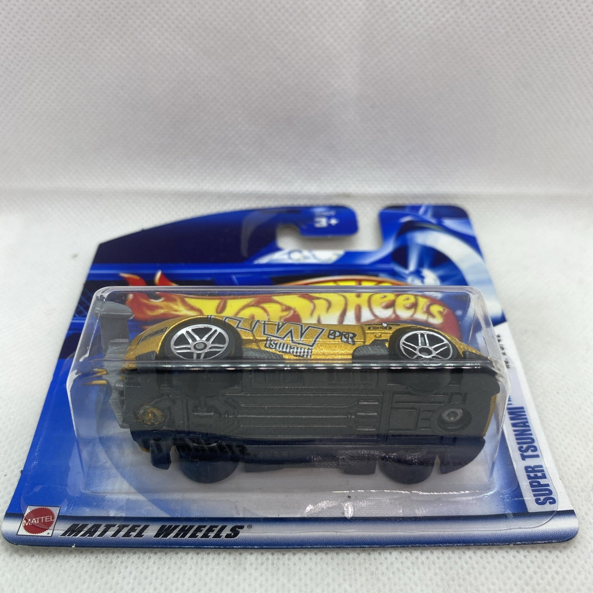 Hot Wheels Super Tsunami die-cast car in sealed blister, side view on short card