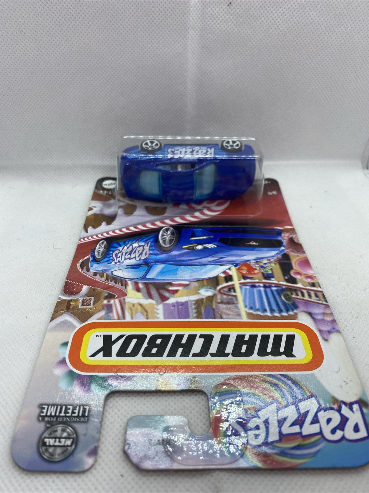 Matchbox toy car blister pack with blue 'Razzles' '19 Ford Mustang Coupe'