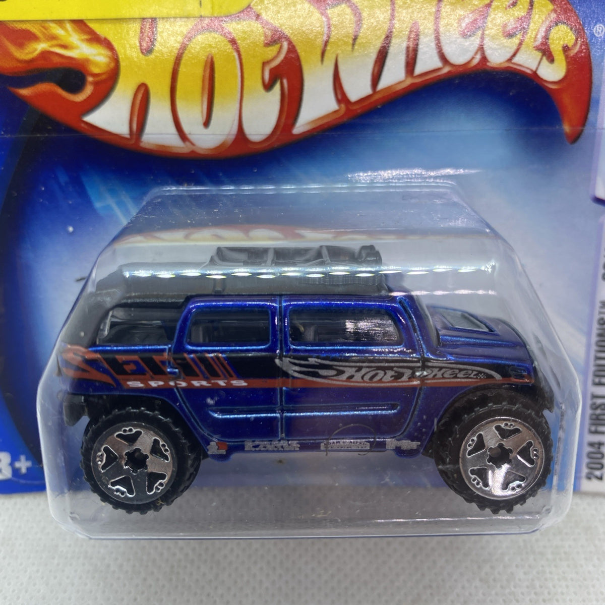 Hot Wheels Rockster die-cast toy car in blue blister, side profile