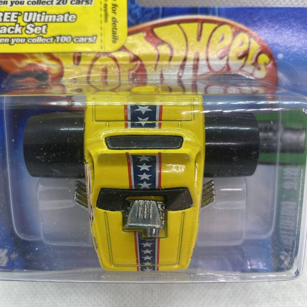 Hot Wheels yellow die-cast Plymouth Barracuda close-up with grille and star stripes