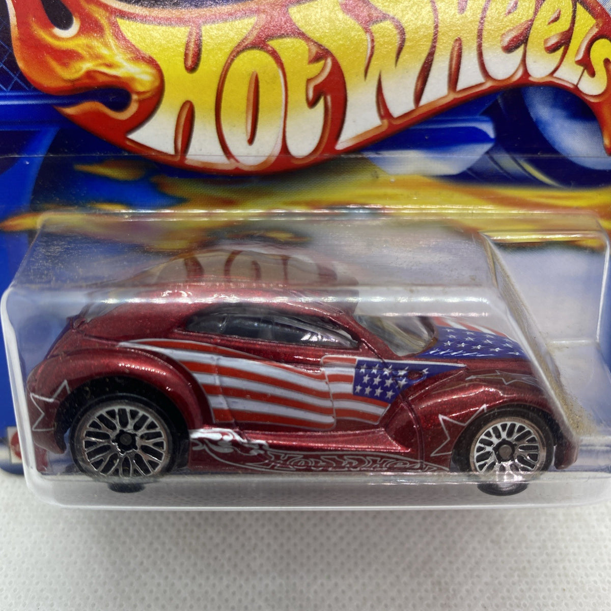 Hot Wheels die-cast car close-up in clear blister, maroon with U.S. flag decal