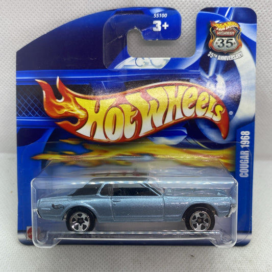 Hot Wheels die-cast ’68 Cougar in silver on blue blister card, front view