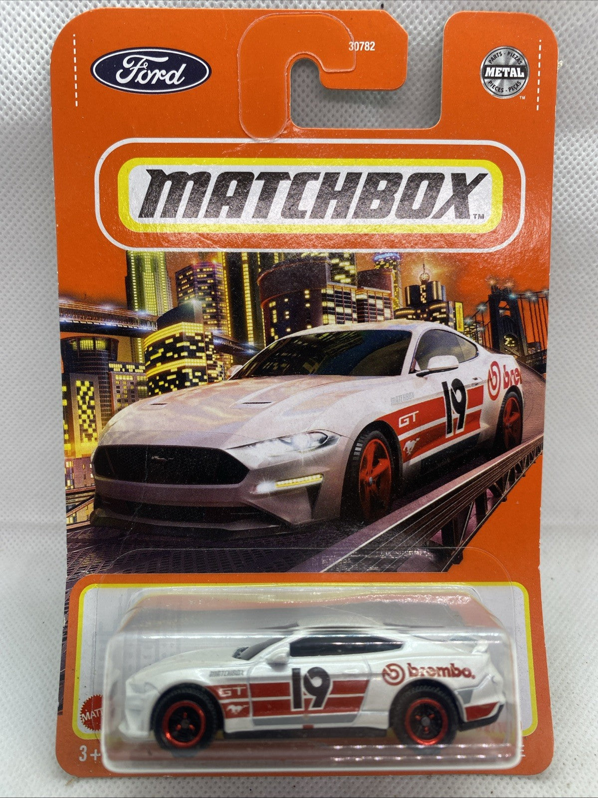Matchbox '19 Ford Mustang Coupe die-cast toy car in orange blister card packaging