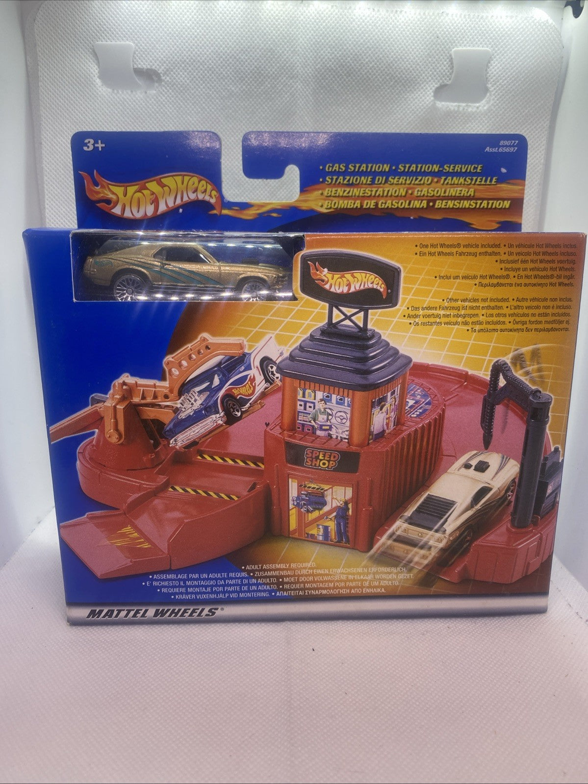 Hot Wheels gas station playset box front showing station, car, and tower details