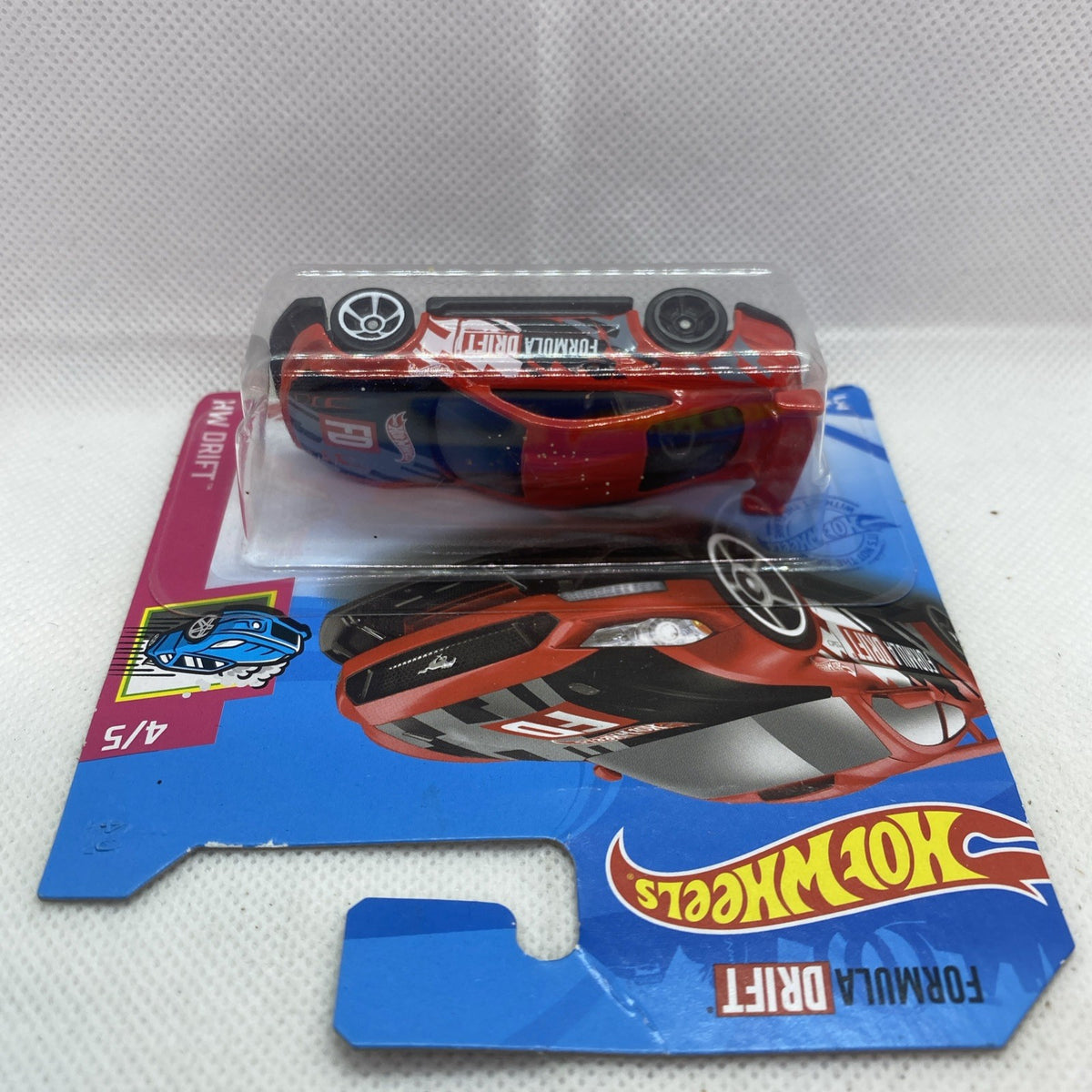Hot Wheels Formula Drift die-cast car in blister pack, top view on blue card