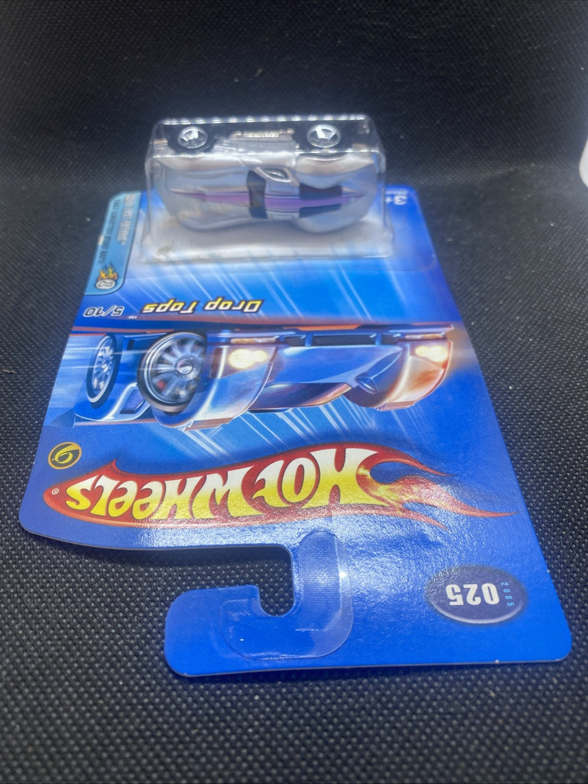 Hot Wheels Corvette model in silver blister, front view on blue package