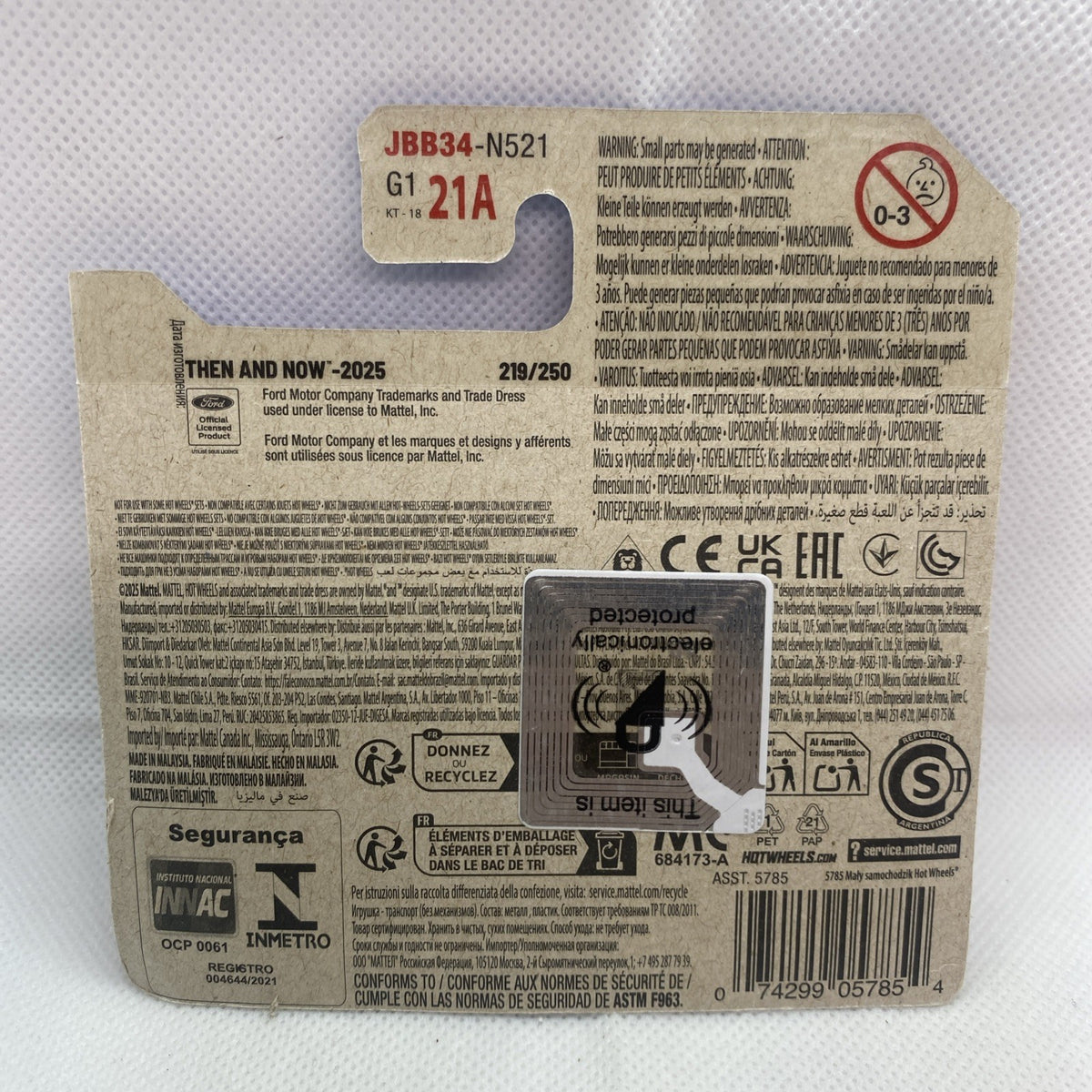 Hot Wheels car blister package back with barcode and safety icons, product info label