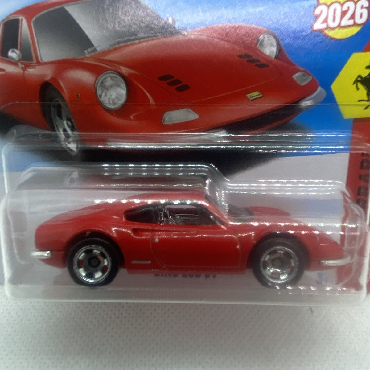 Close-up of red die-cast sports car with chrome wheels in clear blister.