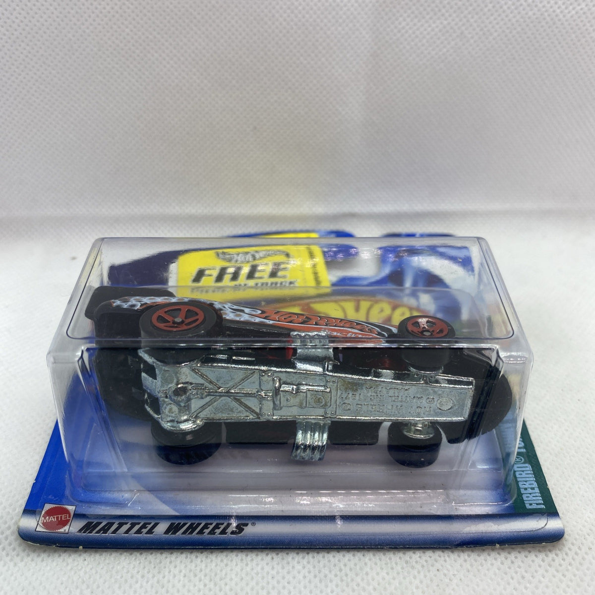 Hot Wheels Funny Car underside in clear blister with blue backing card.