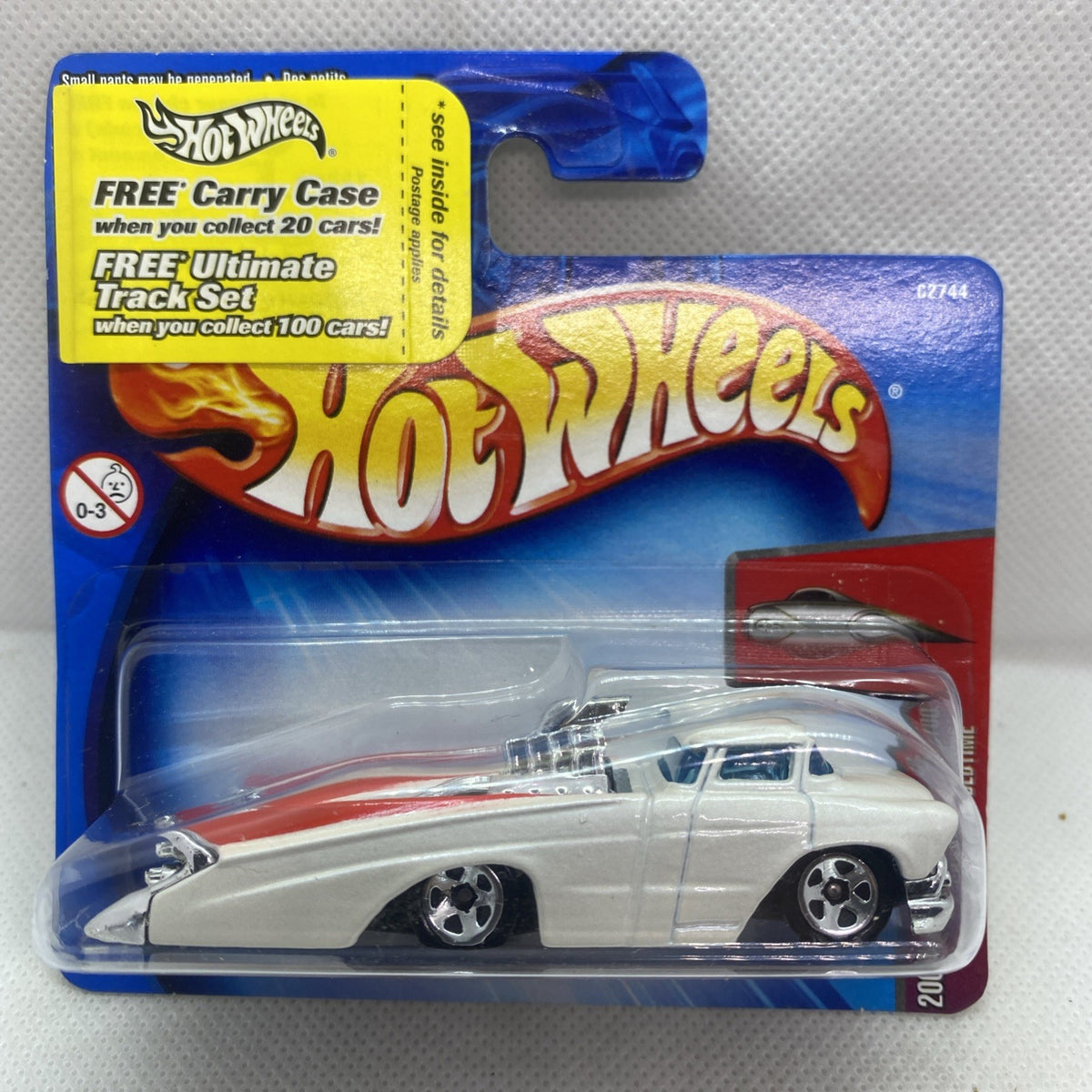 Hot Wheels die-cast car in blister pack with white coupe and red card backing