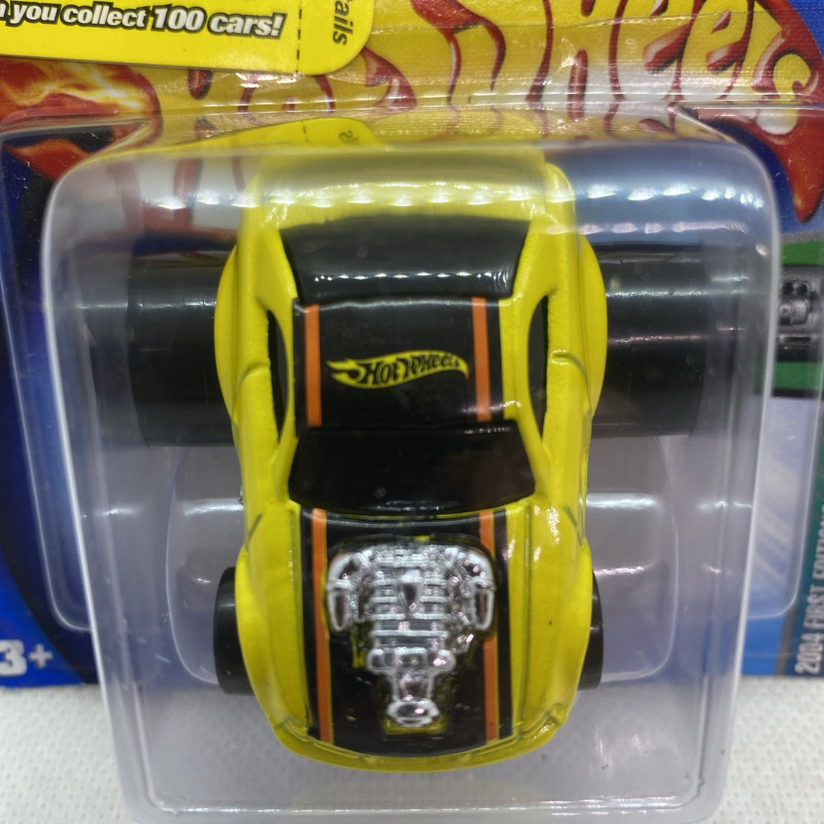 Close-up of yellow Mustang GT toy car in clear blister with black windshield
