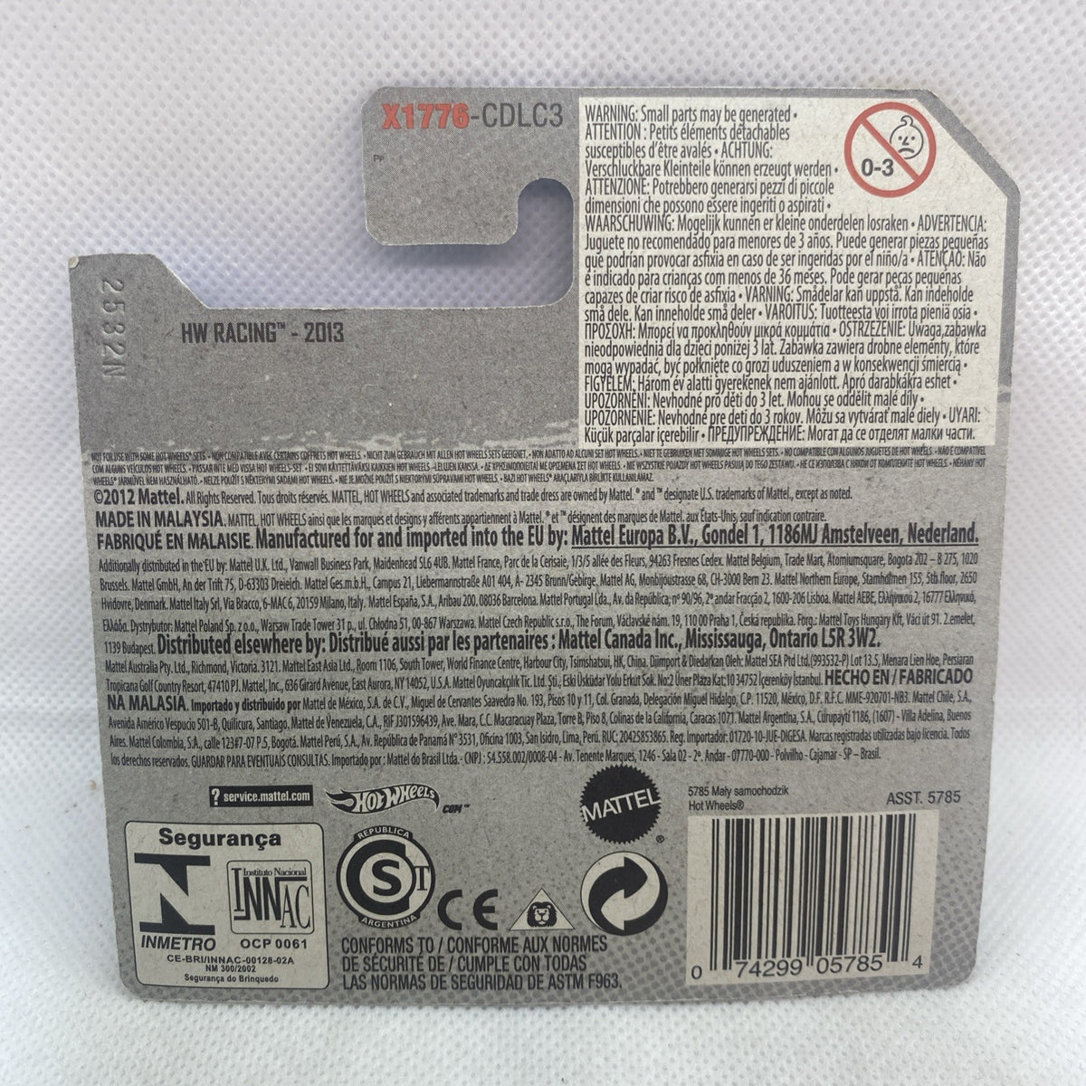 Hot Wheels diecast race car back card with product details and safety information