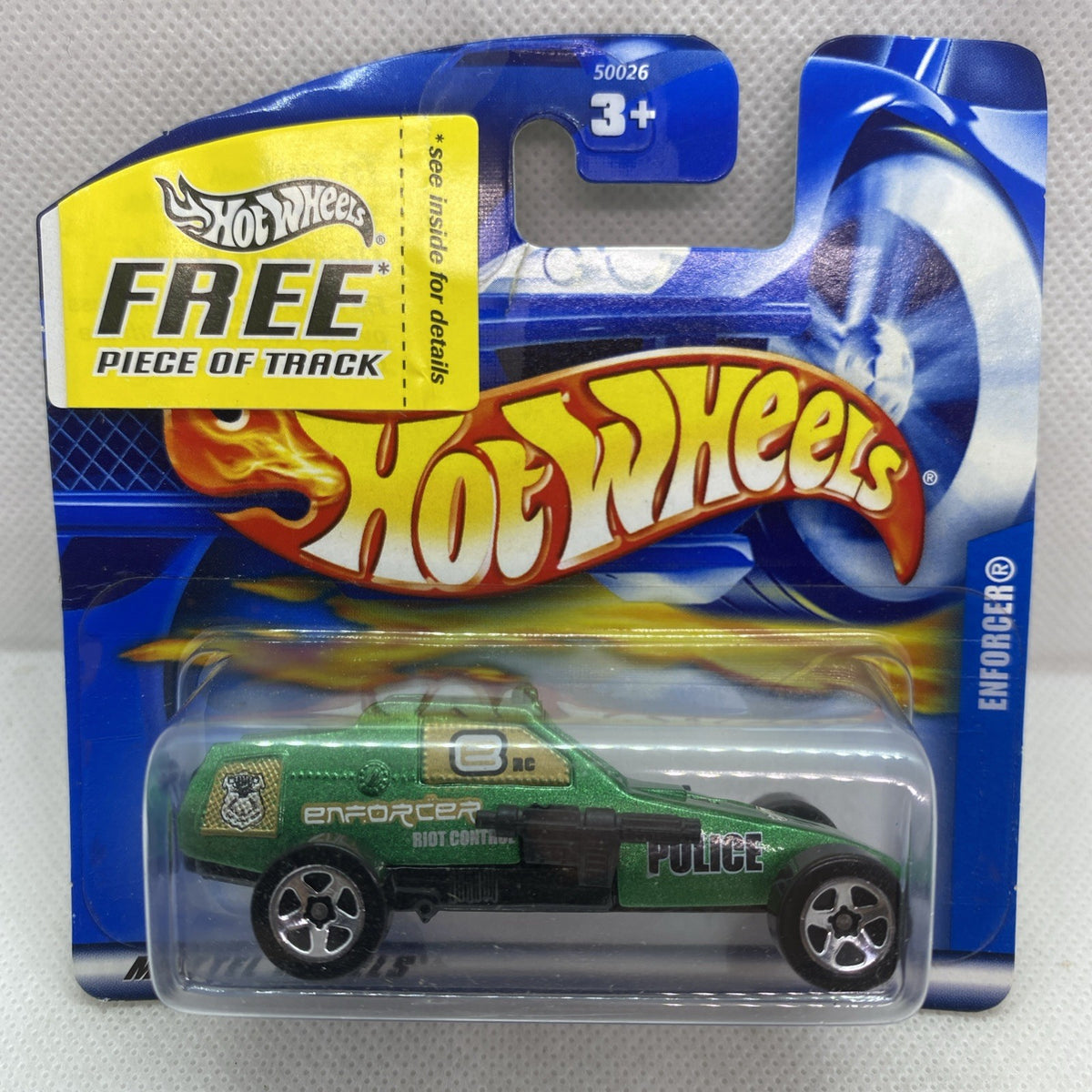 Hot Wheels Enforcer die-cast police car in short card blister, sealed in packaging