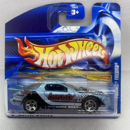 Racing die-cast car in blue blister pack, gray with flame decals and handy logo
