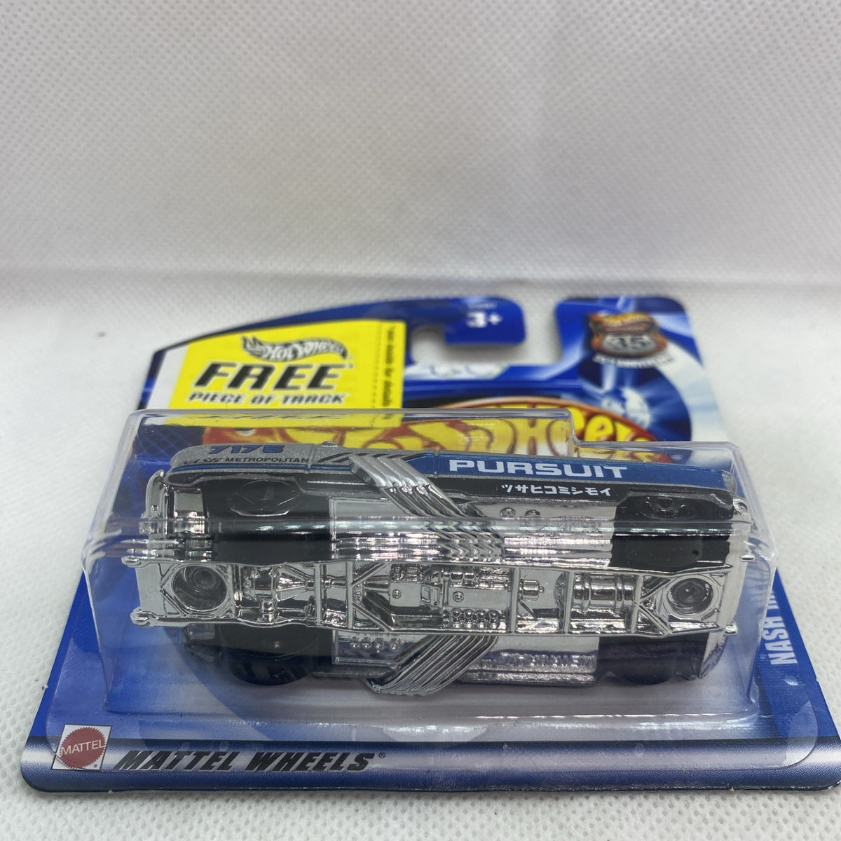 Hot Wheels die-cast car in blister, chrome silver front view labeled “Pursuit”