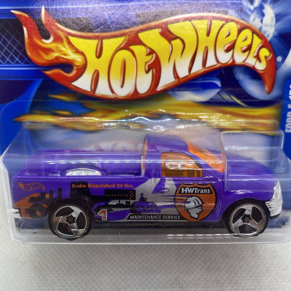 Hot Wheels purple 2002 Ford F-150 die-cast in sealed blister, front side close-up