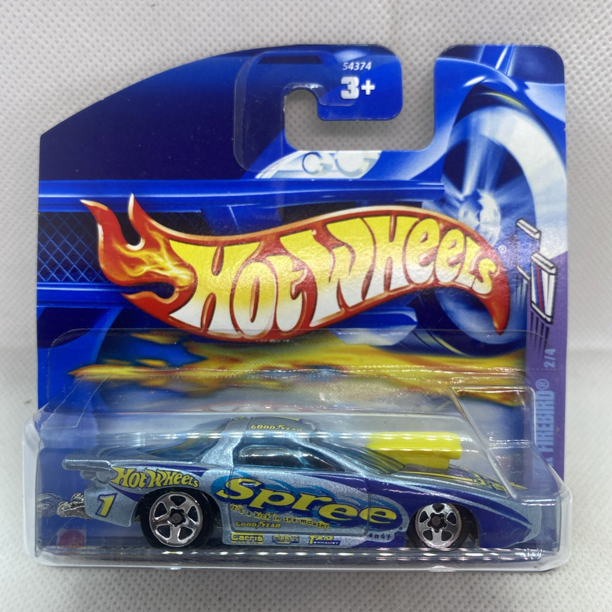 Hot Wheels die-cast car in blue blister pack, yellow spoiler and flame graphics