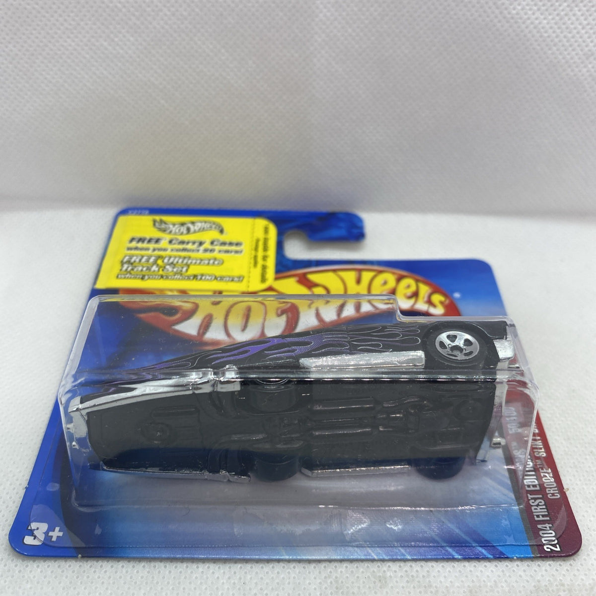 Black flame Hot Wheels die-cast car in clear blister on blue card
