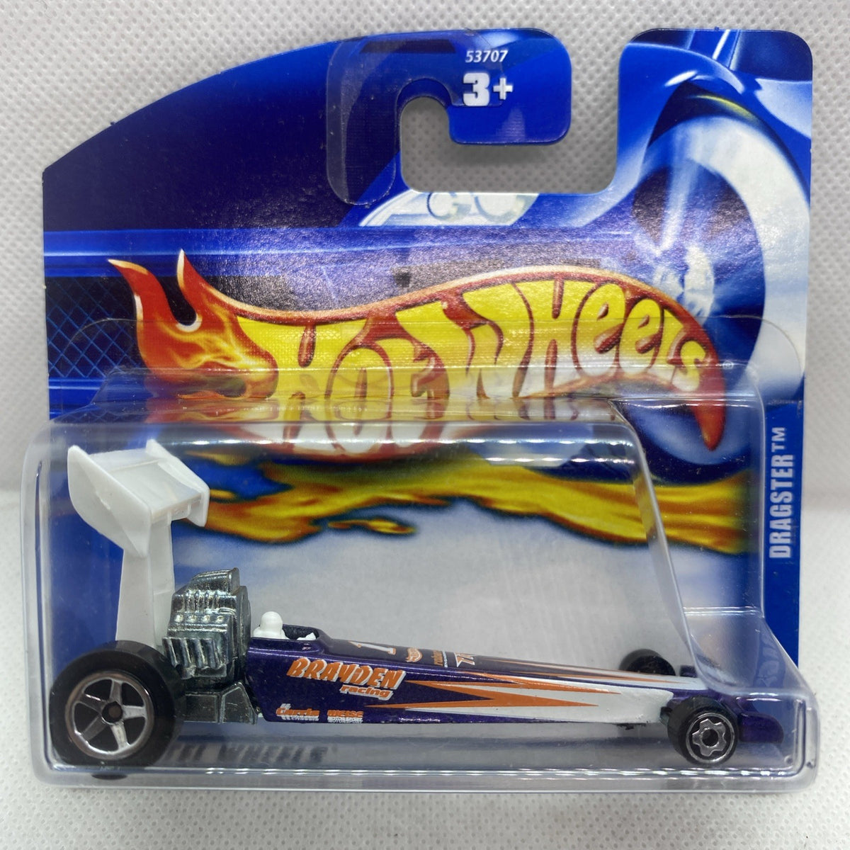 Die-cast dragster toy with flame livery in clear blister on blue Hot Wheels card, #164.