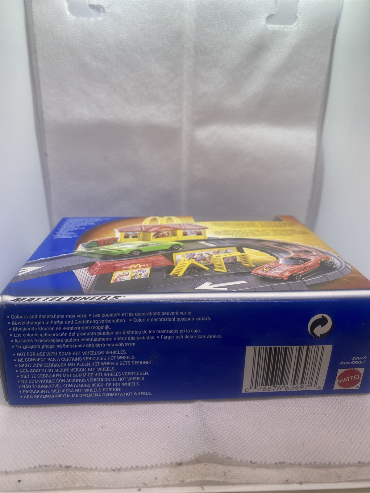 Hot Wheels playset box bottom with barcode and pictured red car in blister