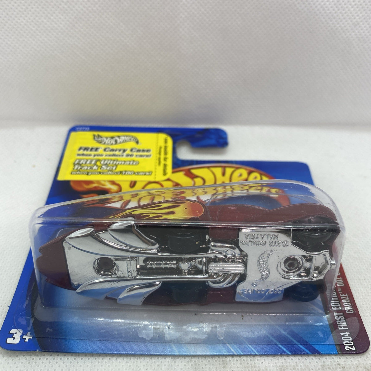 Hot Wheels chrome coupe in clear blister on blue card