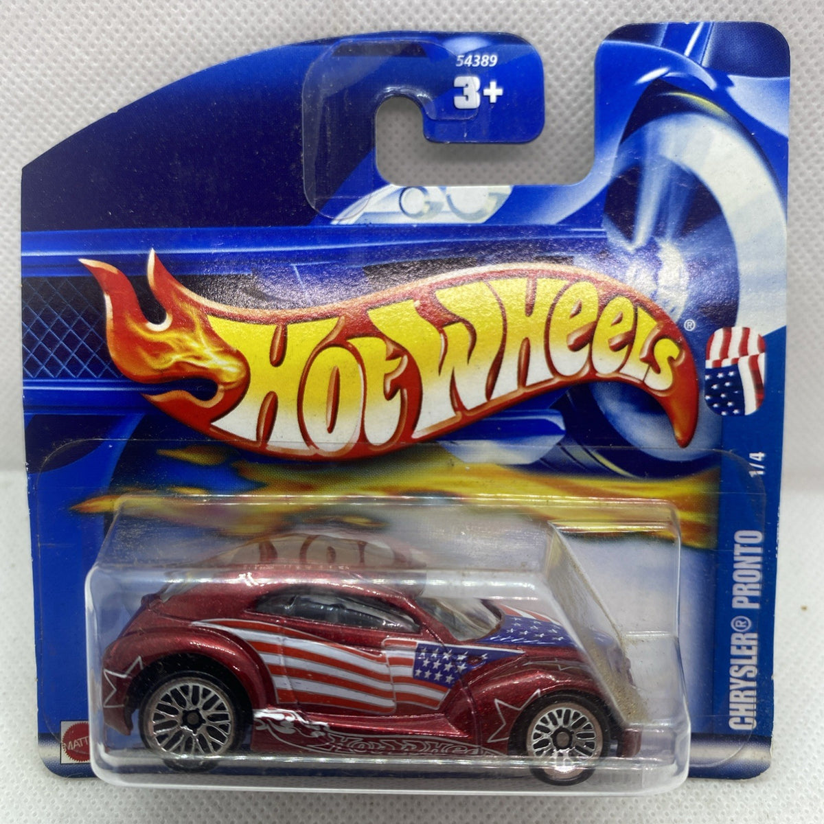 Hot Wheels die-cast car in blue blister card, maroon with U.S. flag stripes