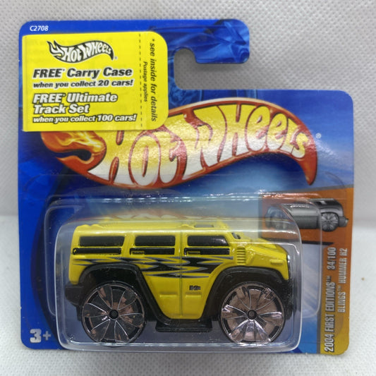 Hot Wheels yellow Hummer H2 2004 die-cast truck in blue blister pack, front view