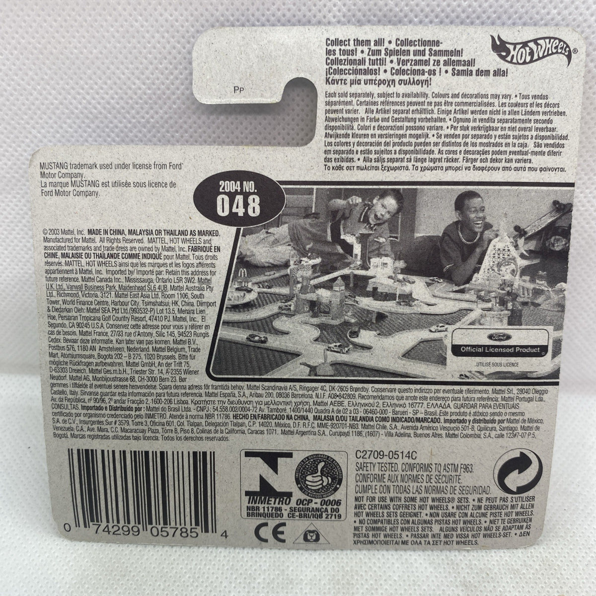 Hot Wheels toy car blister package back with barcode, 2004 #048 text, and safety info
