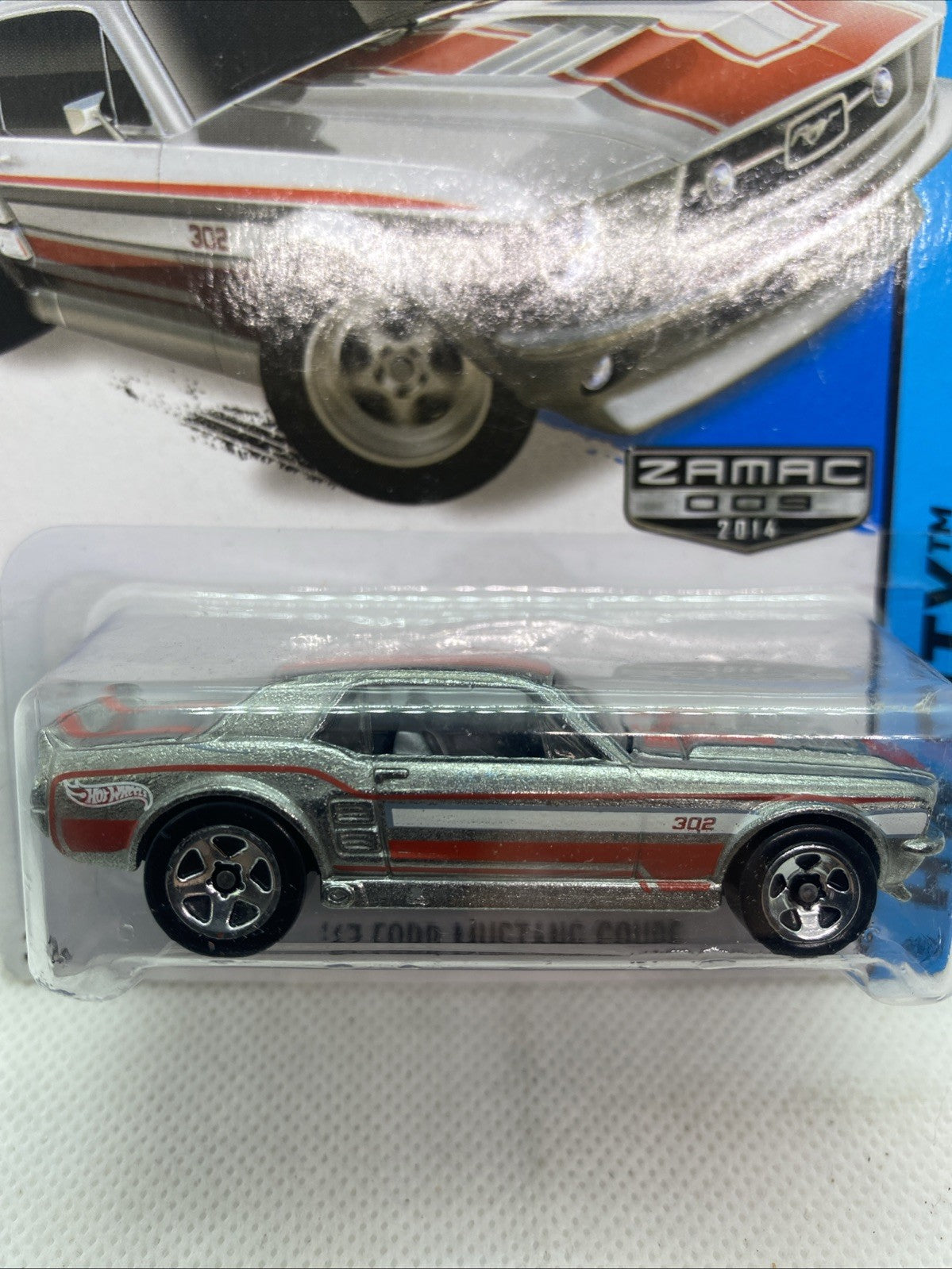 Close view of Hot Wheels ZAMAC Mustang Coupe die-cast with 302 decal