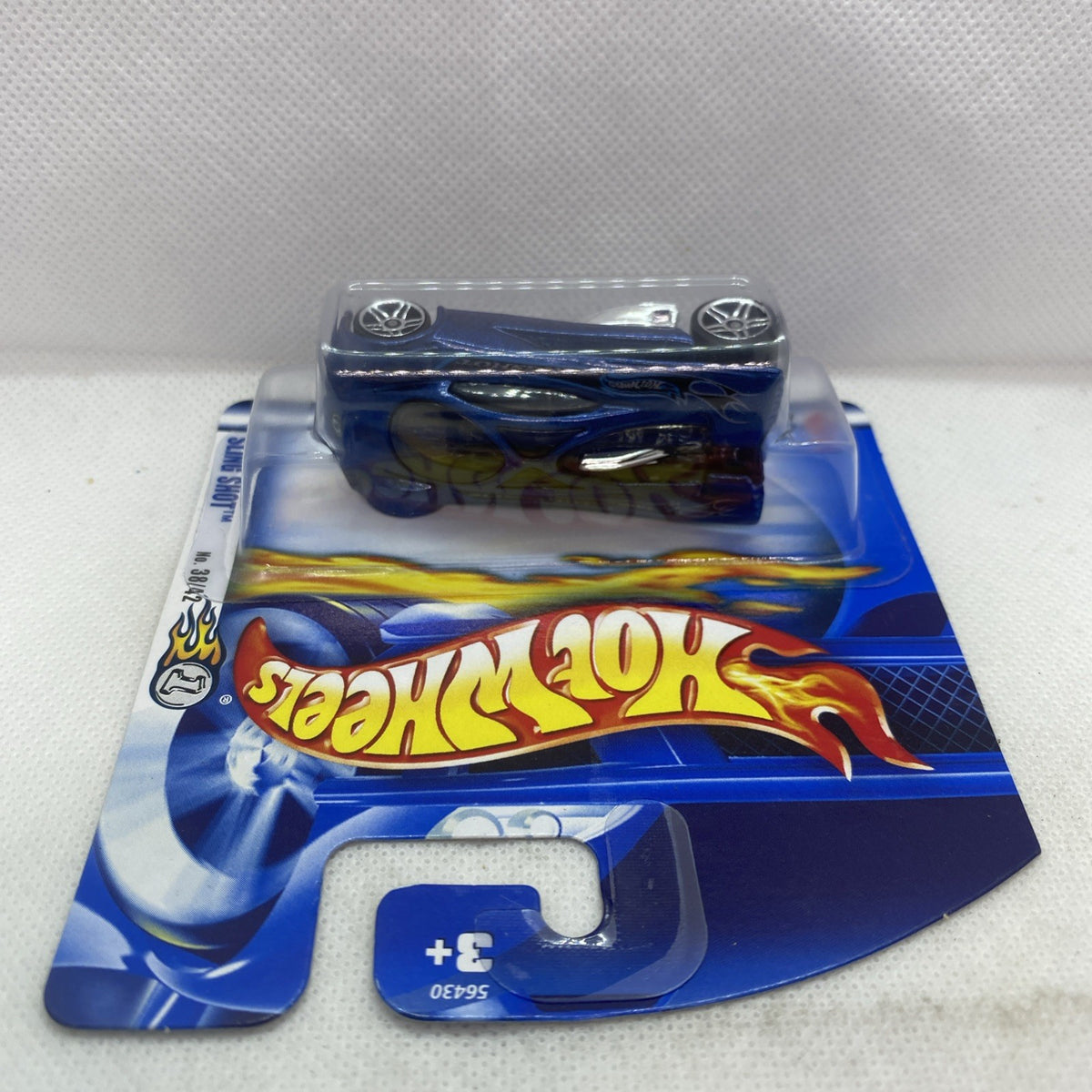 Hot Wheels die-cast car blister card angled view with blue car and Flames title