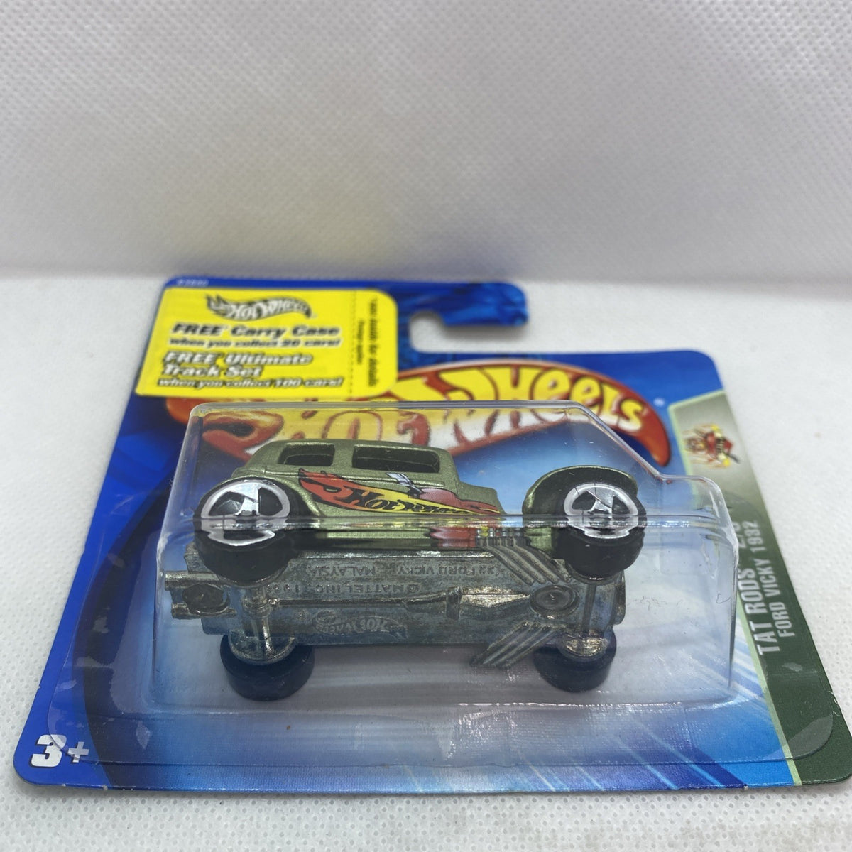 Hot Wheels die-cast green car in sealed blister pack, front angled view