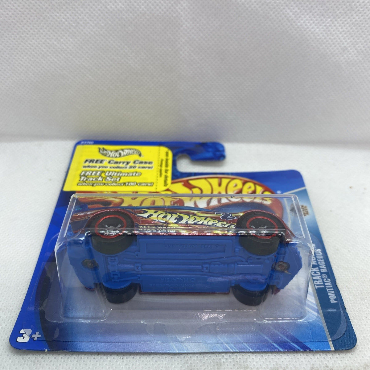 Hot Wheels die-cast car in blister package on blue card, rear view