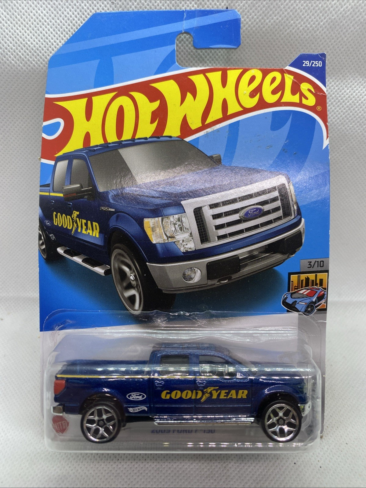 Hot Wheels HW Metro 2009 Ford F-150 die-cast truck in blue short-card package