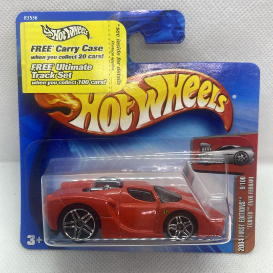 Hot Wheels toy car in clear blister, red sports car with chrome wheels on blue card