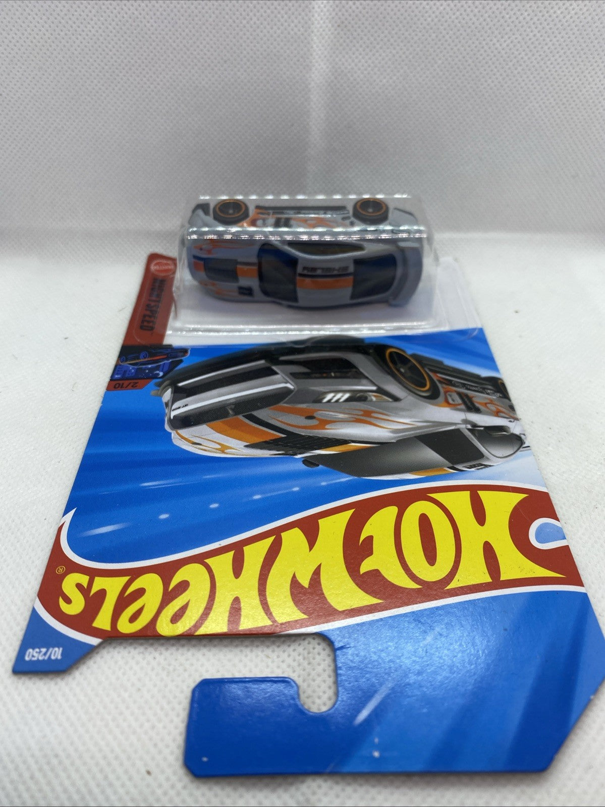 Hot Wheels blister card showing car front view through clear plastic window