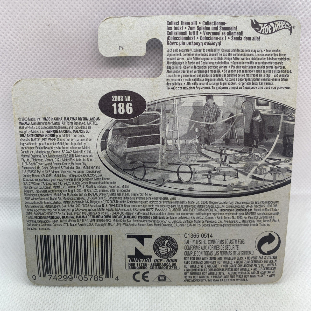 Hot Wheels die-cast toy car blister back card with barcode, icons, and vehicle details.