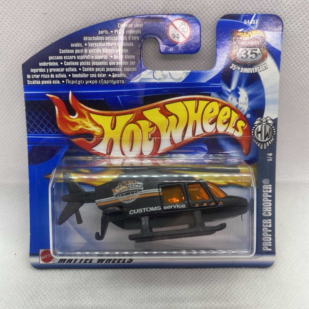 Hot Wheels Propper Chopper die-cast helicopter in blister card, black with orange accents