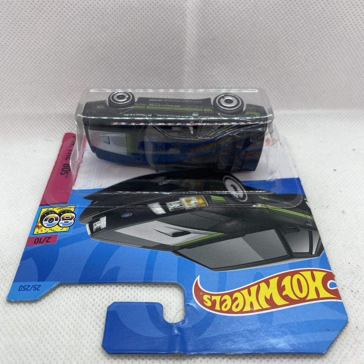 Hot Wheels blister with black Mustang SVO car, side wheels visible