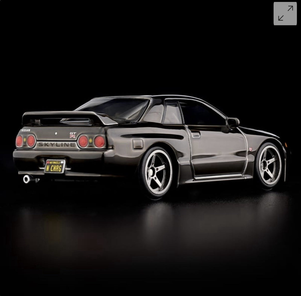 Die-cast sports car model, black rear three-quarter view with Skyline GT-R styling