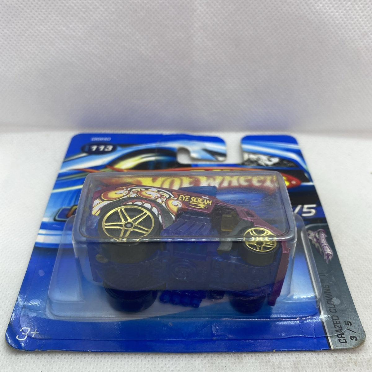 Hot Wheels Cool-One 2005 die-cast car on card, magenta body with blue grille and wheels
