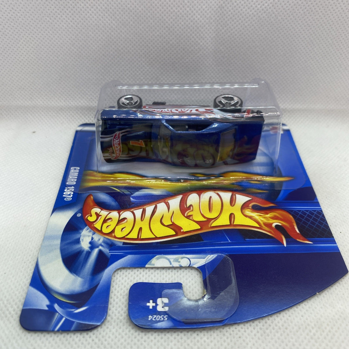 Blue Camaro die-cast toy car in Hot Wheels blister packaging, top view