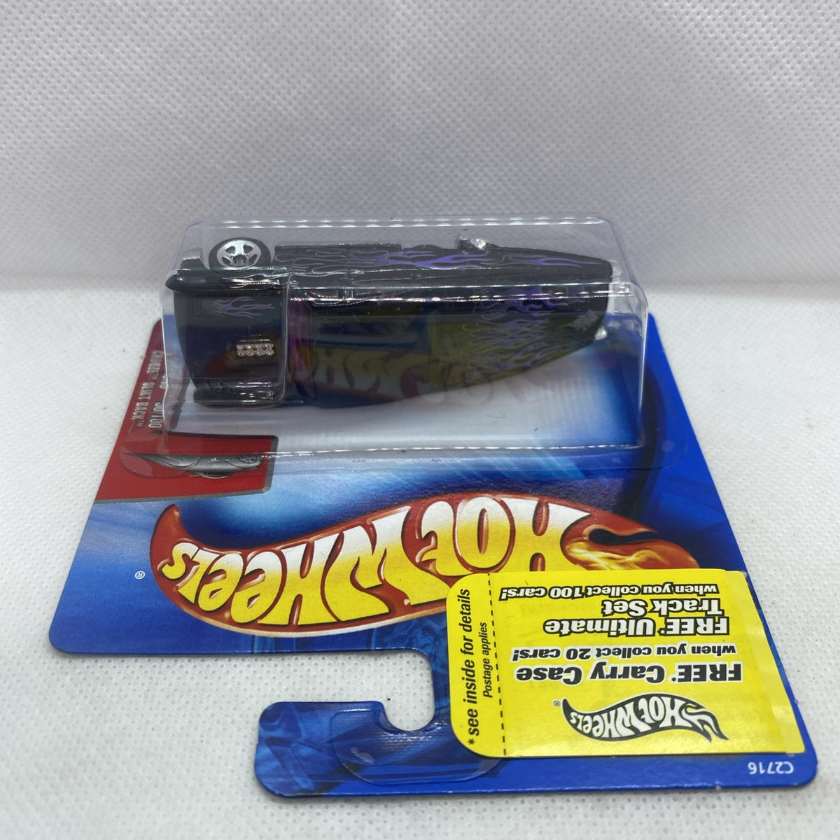 Black flame Hot Wheels die-cast car in blister packaging, angled side view